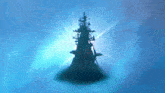 a tower with a shark on top of it in the water