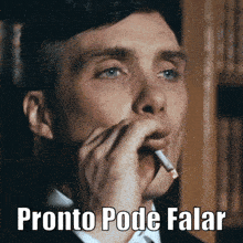 a man is smoking a cigarette with the words pronto pode falar written below him