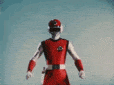 a man in a red suit and white gloves is holding a red sword