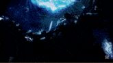 a girl is falling down in a dark room with a blue light behind her .