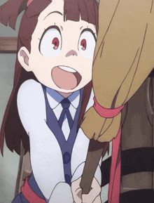 a little girl with red eyes is holding a broom