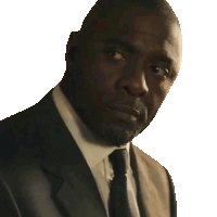 a man wearing a suit and tie looks at the camera