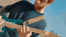 playing the guitar will levy the story so far upside down song strumming guitar
