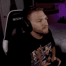 a man wearing headphones and a t-shirt that says raw