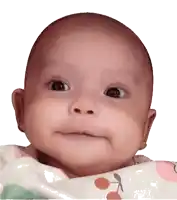 a baby is making a funny face while laying on a blanket
