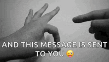 a black and white photo of two hands pointing at each other with the words " and this message is sent to you "