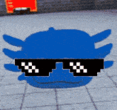 a blue axolotl wearing sunglasses is laying on the ground