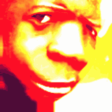 a close up of a person 's face with red and yellow highlights