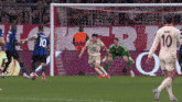 a soccer player with the number 10 on his jersey runs towards the goal