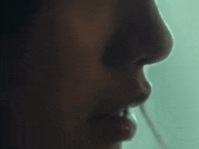 a close up of a person 's eyes in a dark room in a movie .