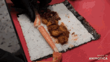 a close up of a sushi roll with the words made in animotica on the bottom