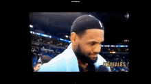 lebron james is talking to another man on a screen that says it 's real85