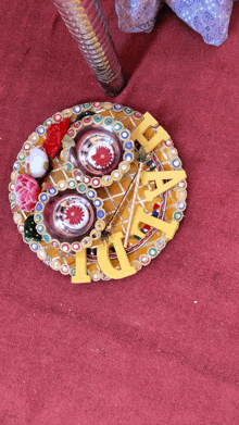 a clock with the word love on it is on a table