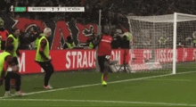 a soccer game between bayer 04 and 1 fc koln is underway