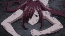 a girl with a bandage on her head and a tattoo on her arm