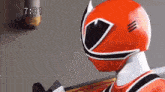a close up of a red power ranger 's helmet with the time 7:31 on the bottom right .