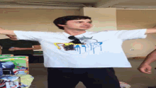 a man wearing a t-shirt with a picture of a cartoon character on it