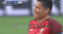 a soccer player with the words " butaxa !!! cs fake " on the screen