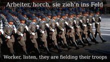 arbeiter horch sie zieh 'n ins feld worker listen they are fielding their troops is written on a poster