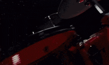 a close up of a black surface with circles and dots on it