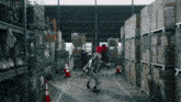 a warehouse filled with lots of boxes and cones and a person in a robot costume