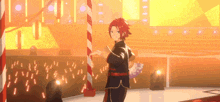 a man is standing on a stage holding a fan .