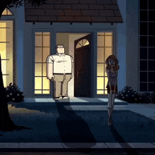 a man and a woman are standing in front of a house at night