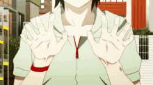 a person is making a funny face with their hands .