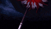 a red light is coming out of a shield in the dark