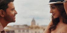a man and a woman are looking at each other with a watermark that says pranay_varma