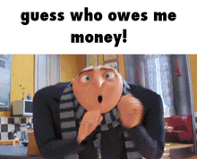 a cartoon character from despicable me is sitting in a chair and looking surprised .