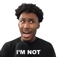 a man in a black shirt is making a funny face and says i 'm not