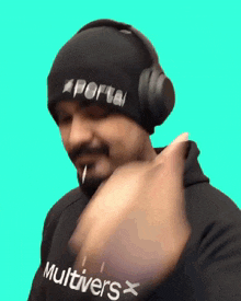 a man wearing headphones and a beanie that says portal multivers