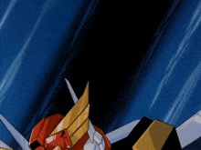 a robot with a red head and yellow wings has the letter d on its chest