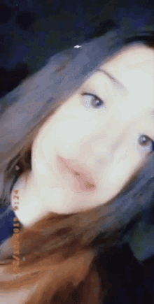 a close up of a girl 's face with a date stamp on the bottom