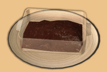 a piece of chocolate pudding on a plate