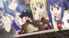 a group of anime girls looking at a cake on a plate