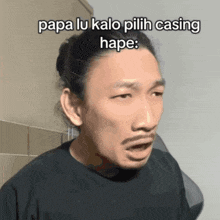a man with a beard is making a funny face with papa lu kalo pilih casing hape