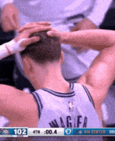a basketball player with the number 102 on the back of his shirt