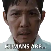 a close up of a man 's face with the words humans are written on it