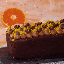 a chocolate cake with orange zest and chocolate frosting