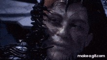 a video game character is being attacked by a monster in a room .