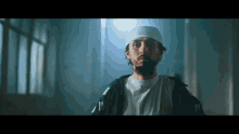 a man with a beard wearing a white headband