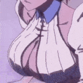 a close up of a woman 's breasts in a sweater with a blue collar .