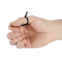 a hand is holding a small object with a rubber band around the finger