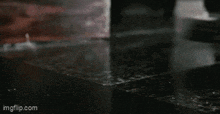 a close up of a person 's feet on a wet surface .