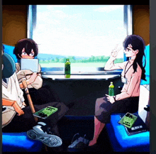 a group of people are sitting in a train car looking out a window