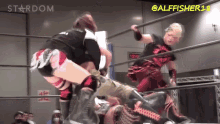two women are wrestling in a ring with the words stardom on the top