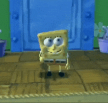 a spongebob squarepants character is standing in front of a blue door .