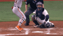 a baseball player with the number 29 on his jersey is about to hit the ball